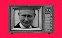 A television, which is broadcasting Russian President Vladimir Putin's face, being turned off