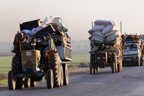 Convoys of displaced Syrians leave Idlib in January.