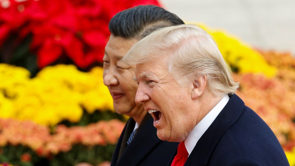 Donald Trump and Xi Jinping meet in Beijing in 2017.