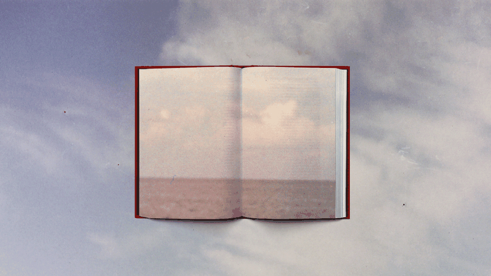 A book opened to an image of an open horizon, set against a blue sky