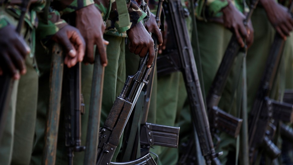 Kenyan soldiers holding guns.
