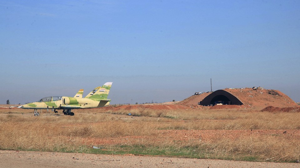 Warplanes inside the Kweiras air base, east of Aleppo, Syria. 
