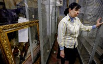 A worker in Kherson at a museum that was looted by the city’s Russian occupiers
