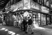 A man walking down a street in Brooklyn