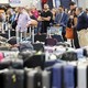 Travelers wait for their bags at Los Angeles International Airport on June 29.