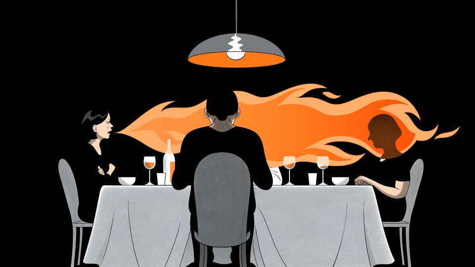 image of a woman breathing fire at a dinner table with several other guests