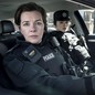 Two female cops from Blue Lights sit in a car