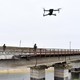 A drone hovers over railway tracks in a Russian-occupied location in Ukraine’s Kherson region.