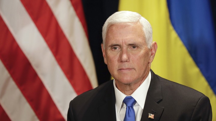 Vice President Mike Pence in front of the American and Ukrainian flags