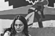 An image of Dolores Huerta looking downward and solemn.