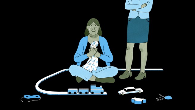 a mother crying with child's toys