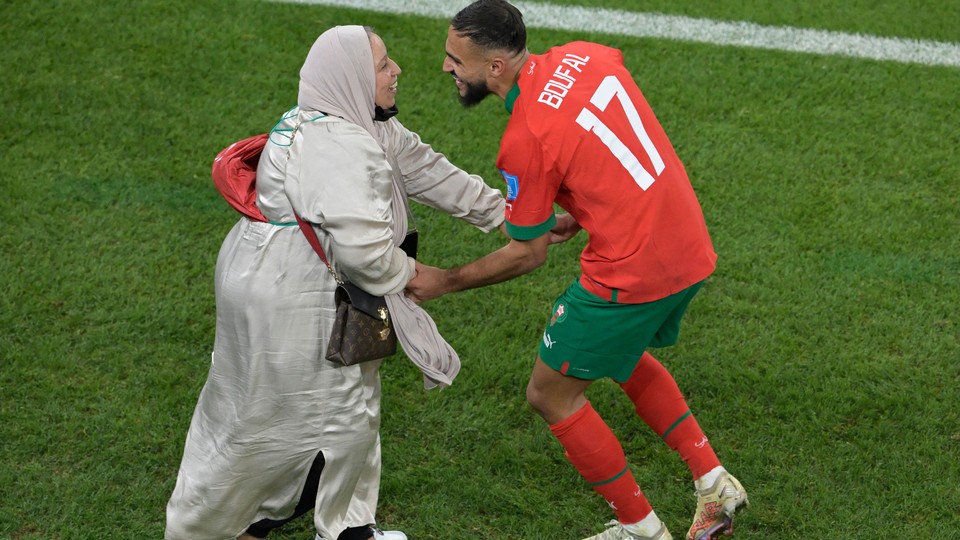 Sofiane Boufal dances with his mother after Morocco's win against Portugal.