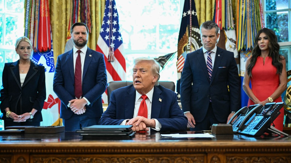 Trump with members of his cabinet in the back