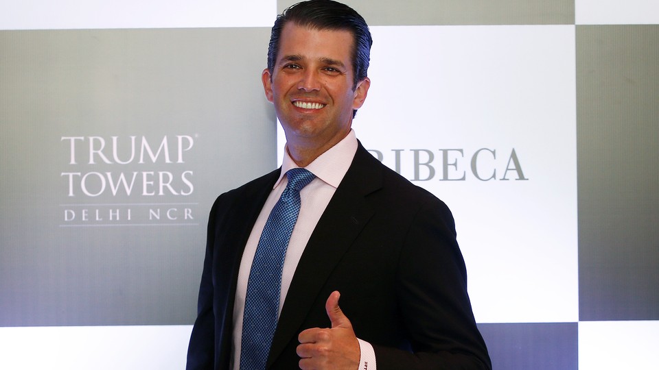 Donald Trump Jr. smiles and flashes a thumbs-up 