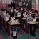 A group of students sits in a parochial-school classroom