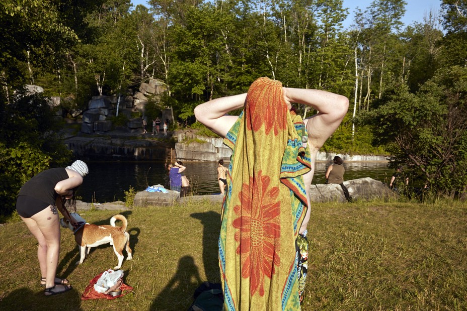 a person toweling off after wild swimming
