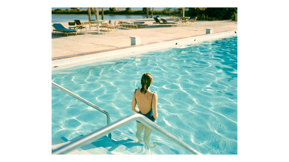 A woman standing in a pool