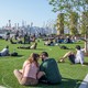 A photo of people socially distanced at a park