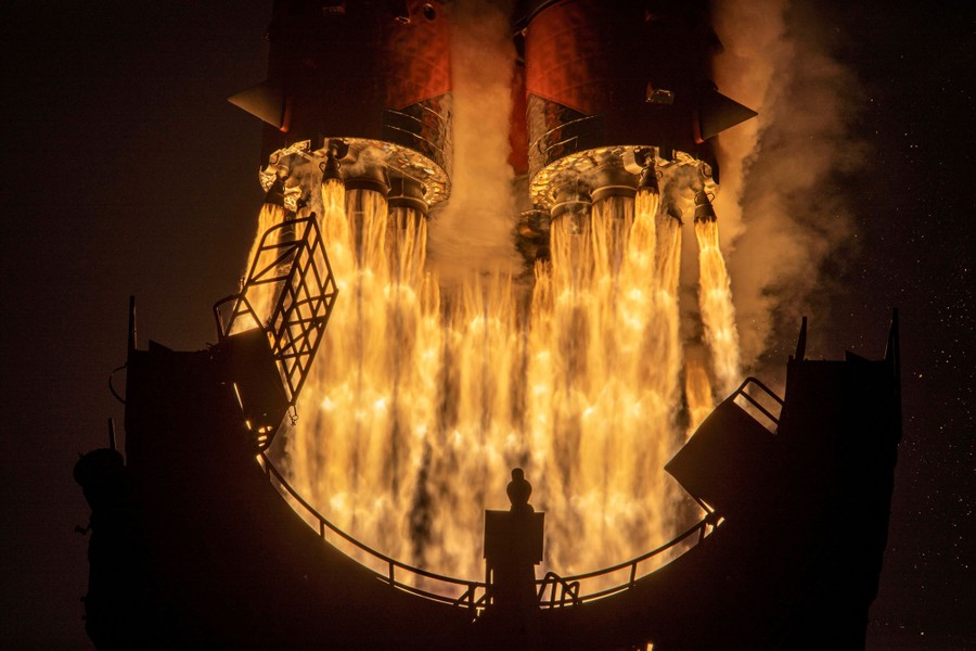 Flames erupt from the base of a rocket moments after it launches.