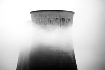 A nuclear power plant partly obscured by fog