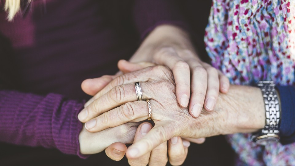 Two hands holding each other