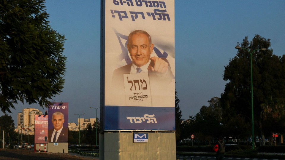 Israeli election banners for former Israeli prime minister Benjamin Netanyahu and current prime minister Yair Lapid.
