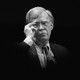 Black-and-white image of John Bolton's bust in front of a black background