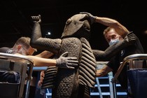 Photo of a statue in a Paris museum, marked for return to Benin