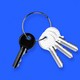 A photo illustration of four keys on a keychain, three white facing to the right and one black facing to the left, all on a blue background.