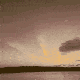 GIF of a flock of vaccine syringes flying across a landscape