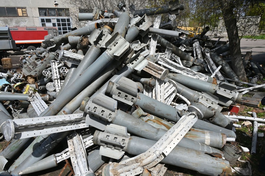 A pile of canisters and components of used missiles.