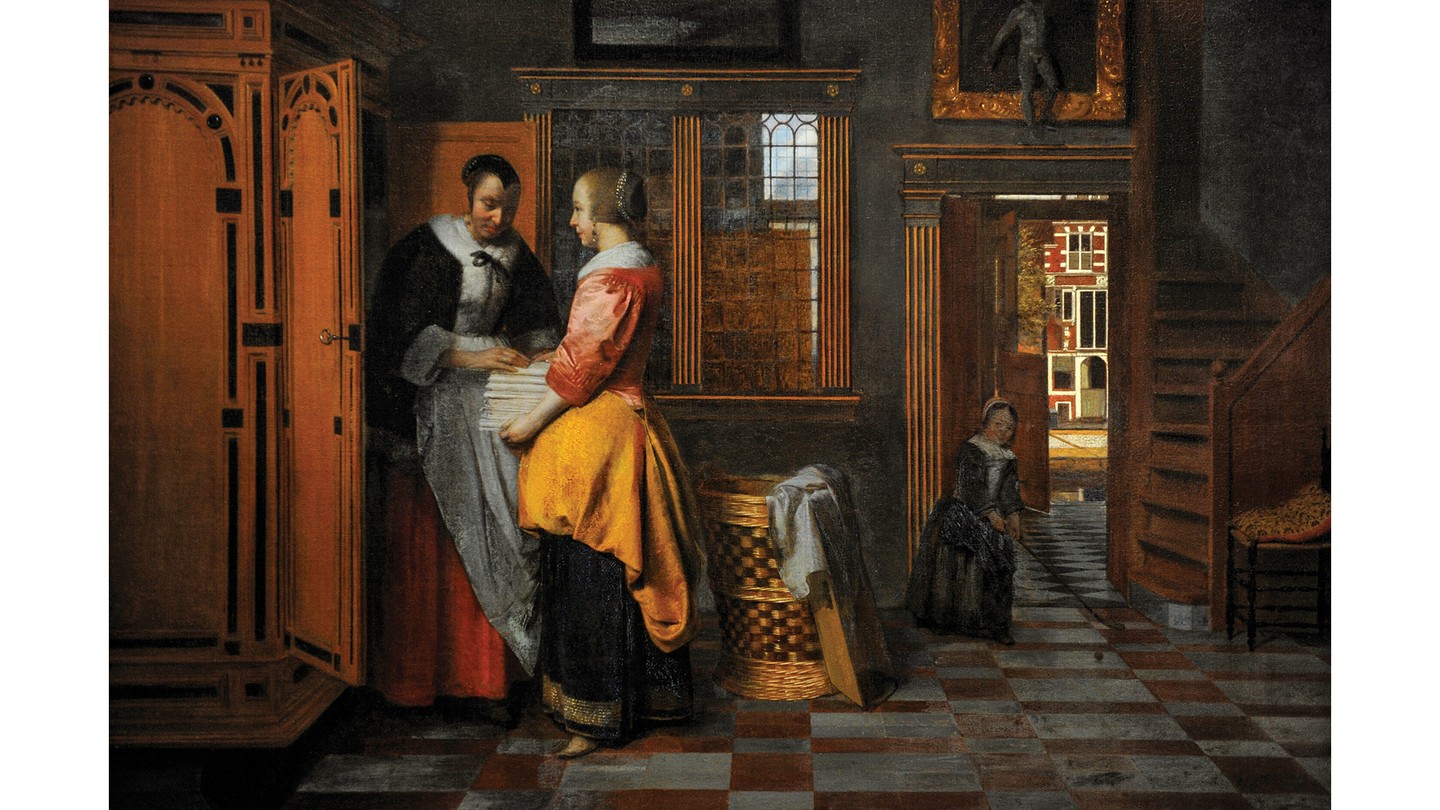 oil painting of ornate 1663 Dutch interior with two women unloading sheets from a large open wooden cupboard on left, and young girl in doorway near stairs