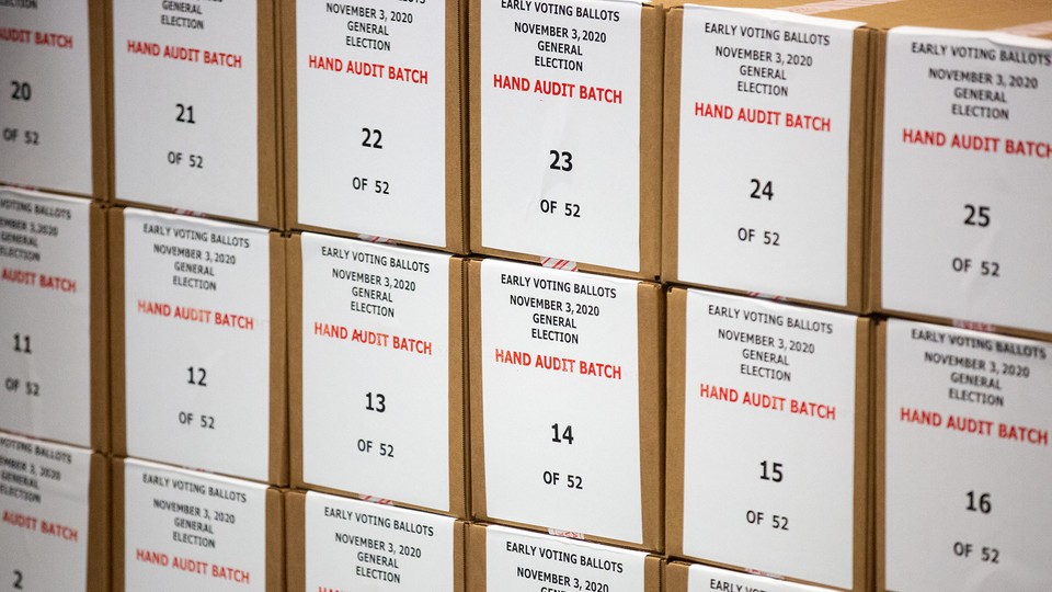 Arizona early voting ballots stacked in boxes dated November 2020.