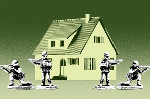 soldiers stationed in front of a house