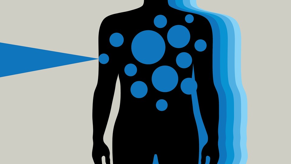 A silhouette of a person with blue spots