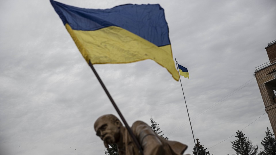 Ukrainian flag waving in front of a cloudy sky