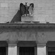 A black-and-white photograph of the facade of the Federal Reserve building