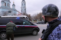 A vehicle carrying the Wall Street Journal reporter Evan Gershkovich drives away from a court building in Moscow, Russia, on March 30, 2023.