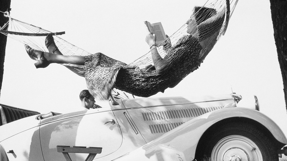 A woman reading in a hammock