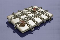 An image of a laptop chained up.