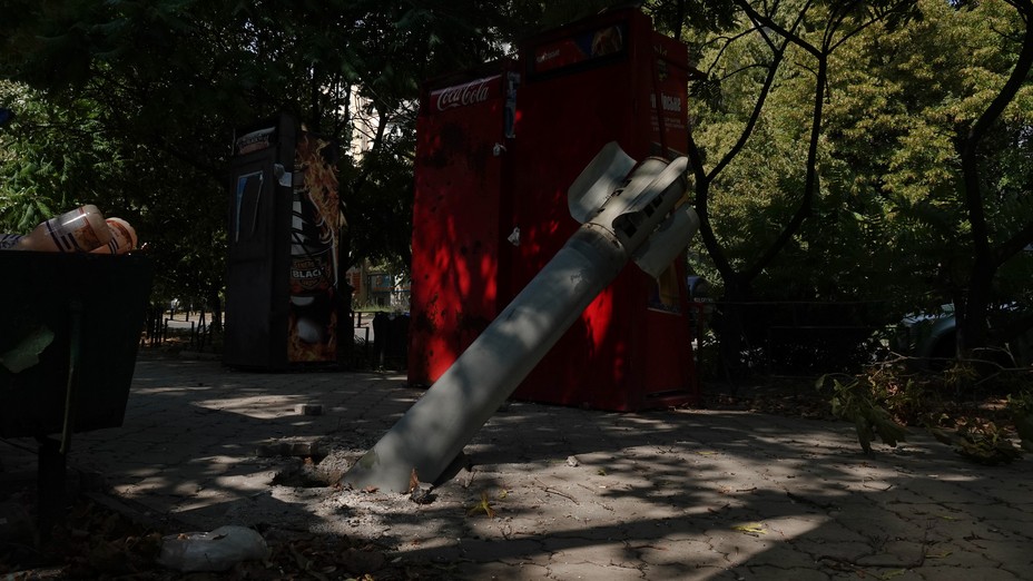 A shell is seen in the ground in Ukraine