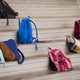 Different colored backpacks scattered on the bleachers