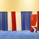 A CPAC banner and red, white, and blue curtains