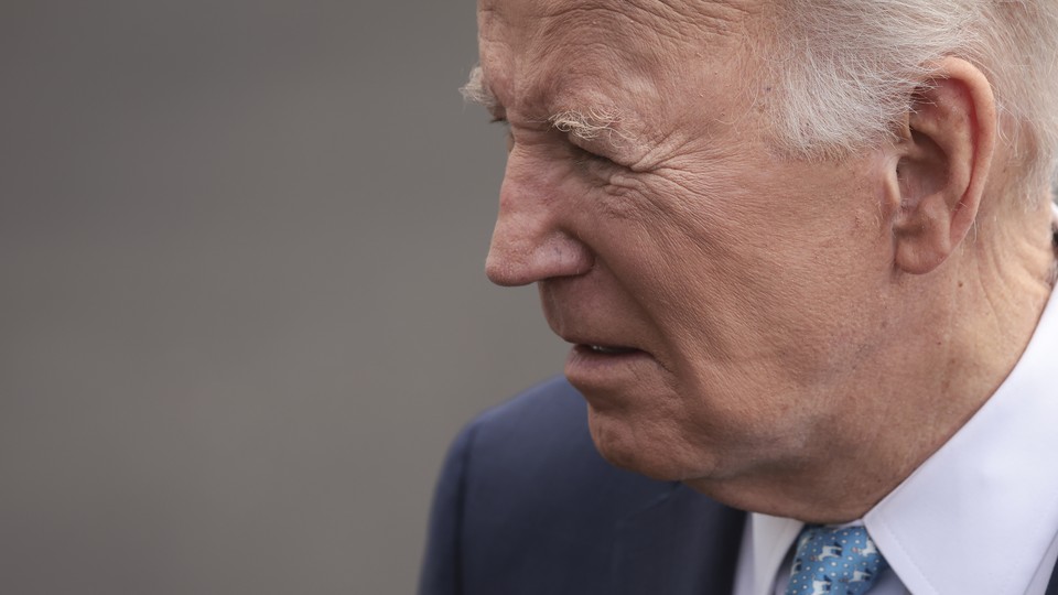 A photo of Joe Biden's face from the side while he looks down