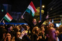 Attendees at a Tisza-party election event cheer as Hungarian Prime Minister Viktor Orbán concedes during parliamentary elections in Budapest