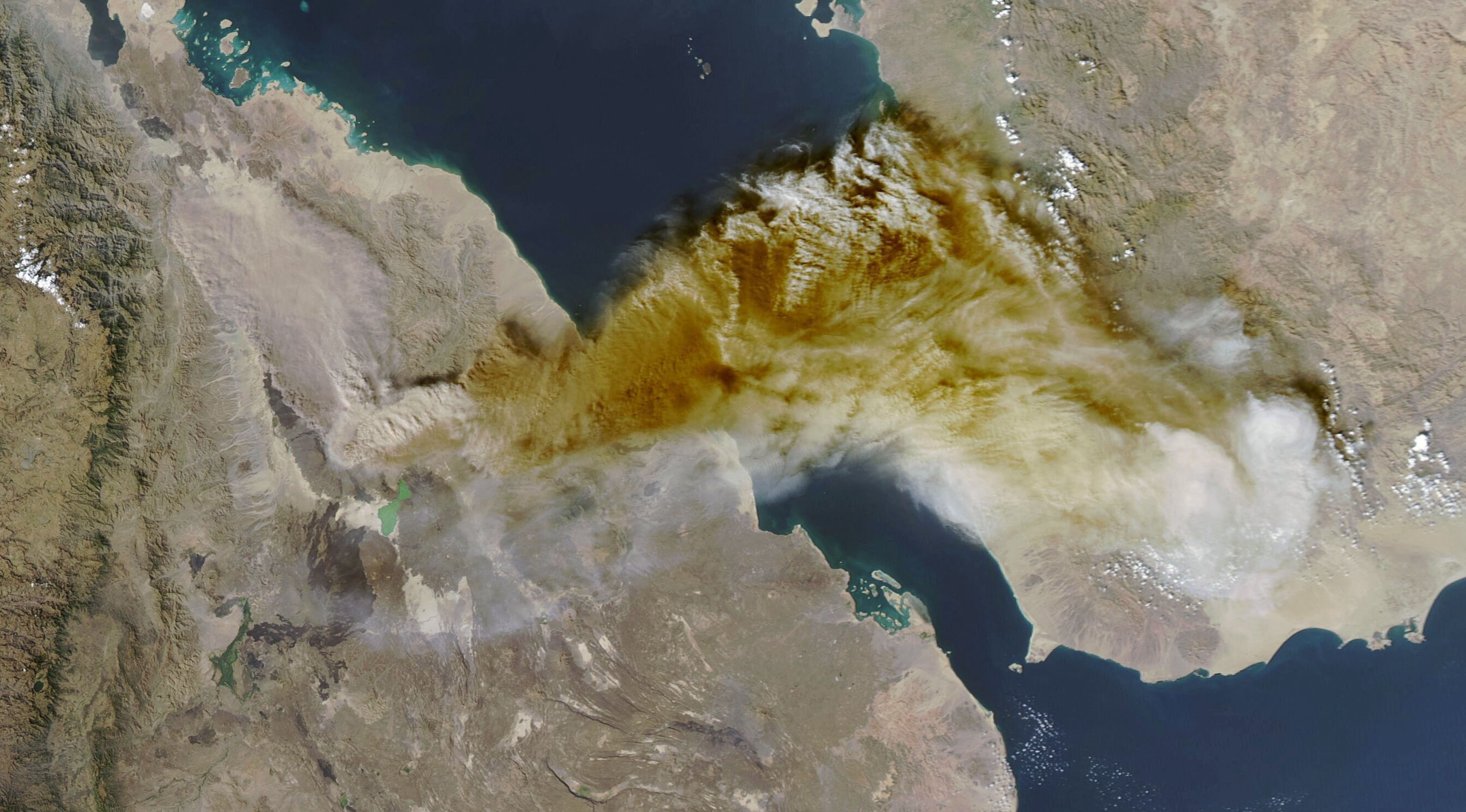 A satellite view of a broad cloud of ash blowing across the Red Sea.