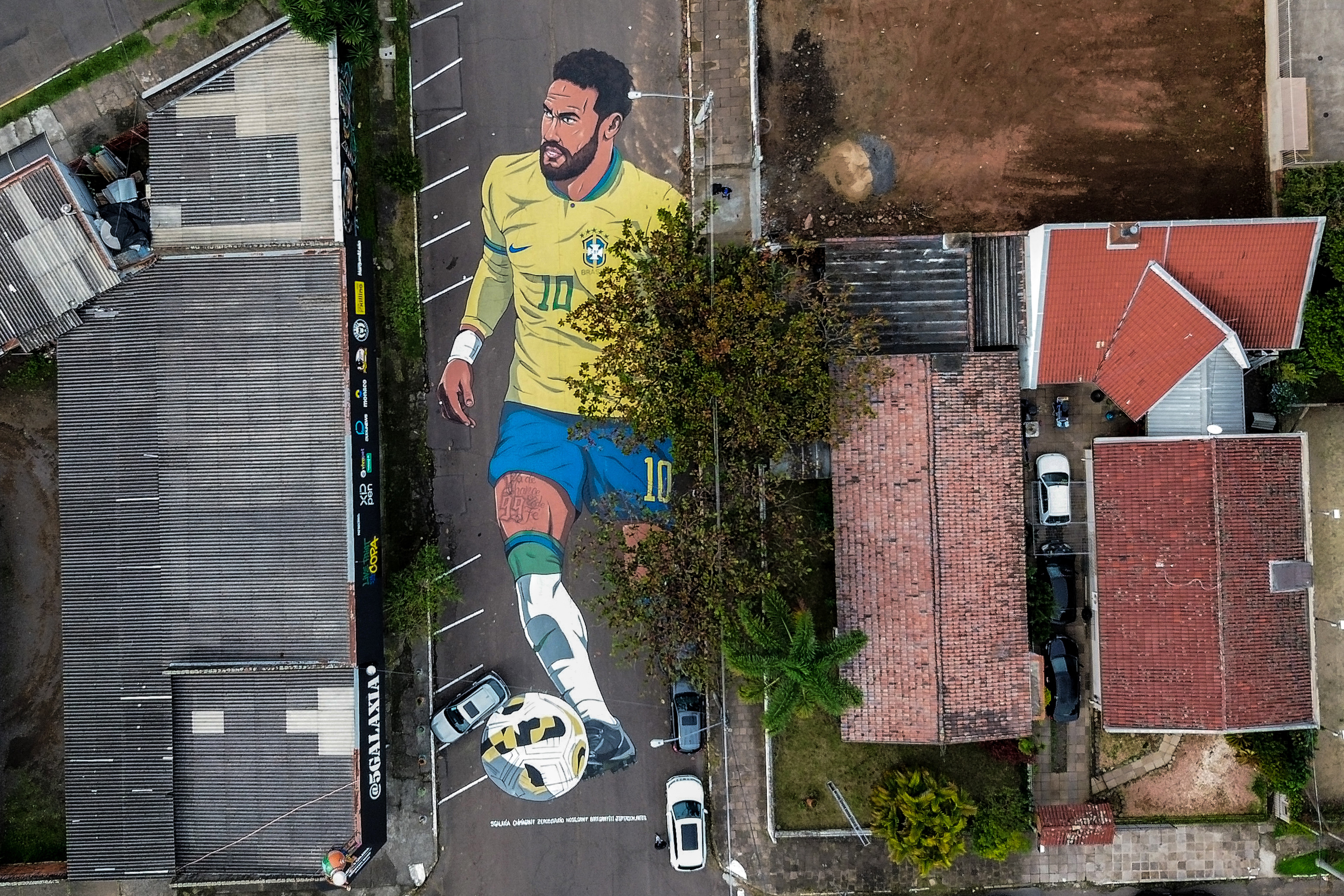 An aerial view of a street painting depicting the Brazilian football star Neymar.