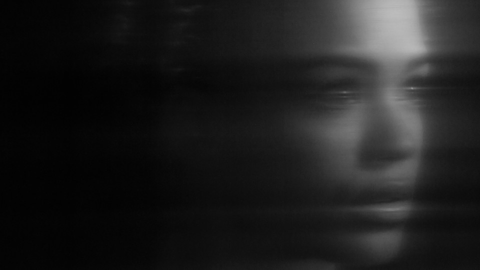 a blurred face in profile