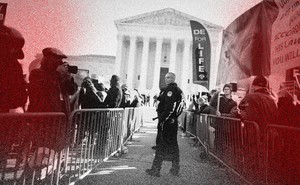 Police use metal barricades to keep protesters, demonstrators and activists apart in front of the U.S. Supreme Court