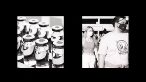 a two-channel video in black-and-white: the one on the left is of a factory line of medical vials, and the other is of people in masks walking
